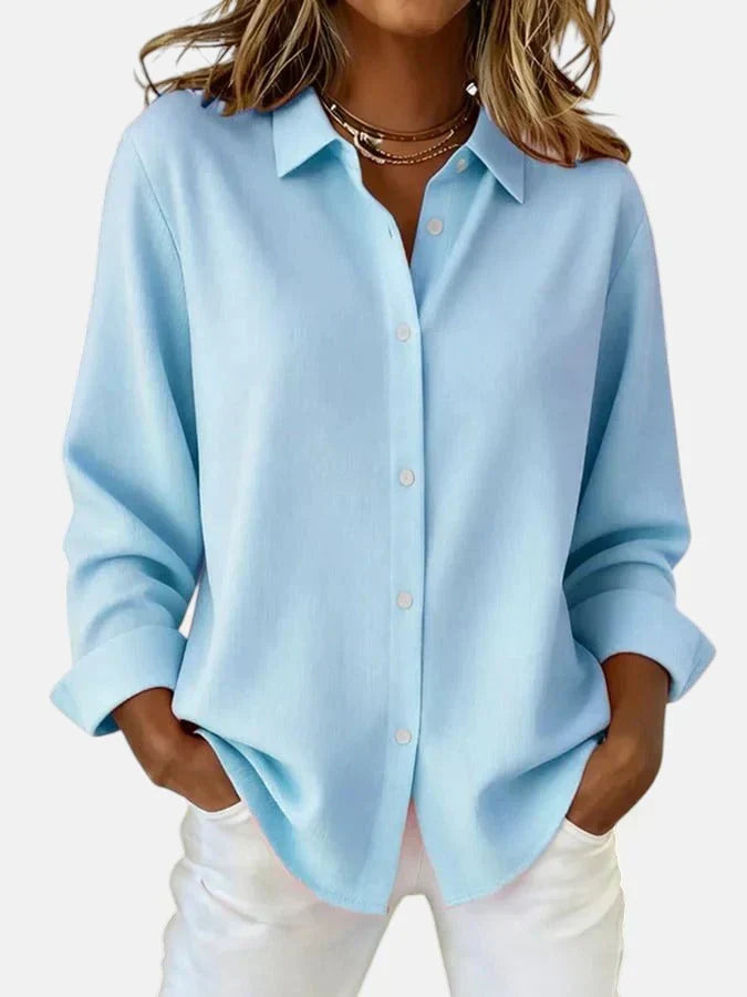 Effortless style with this elegant women's button-collar blouse. Long-sleeve top for fashionable comfort.