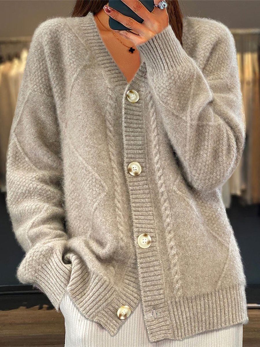 Stylish women's V-neck cable knit cardigan sweater, a versatile long-sleeve layering piece with button detail.