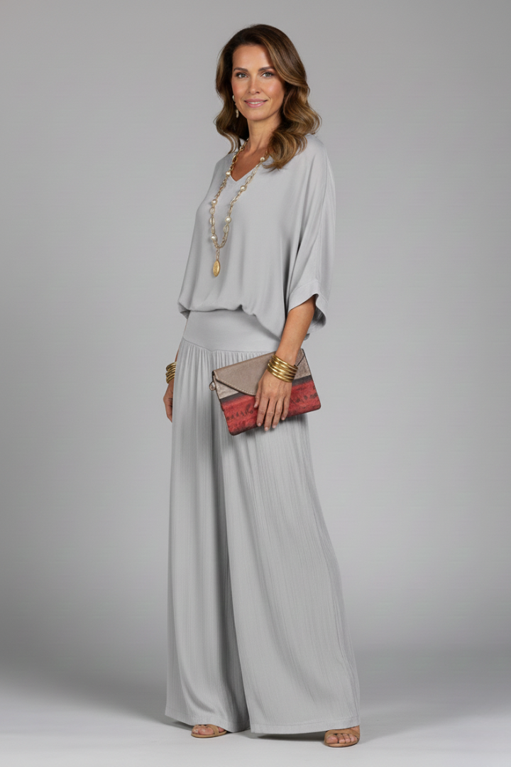 Women's versatile chiffon two-piece with a flowy top and wide-leg pants, perfect for summer.