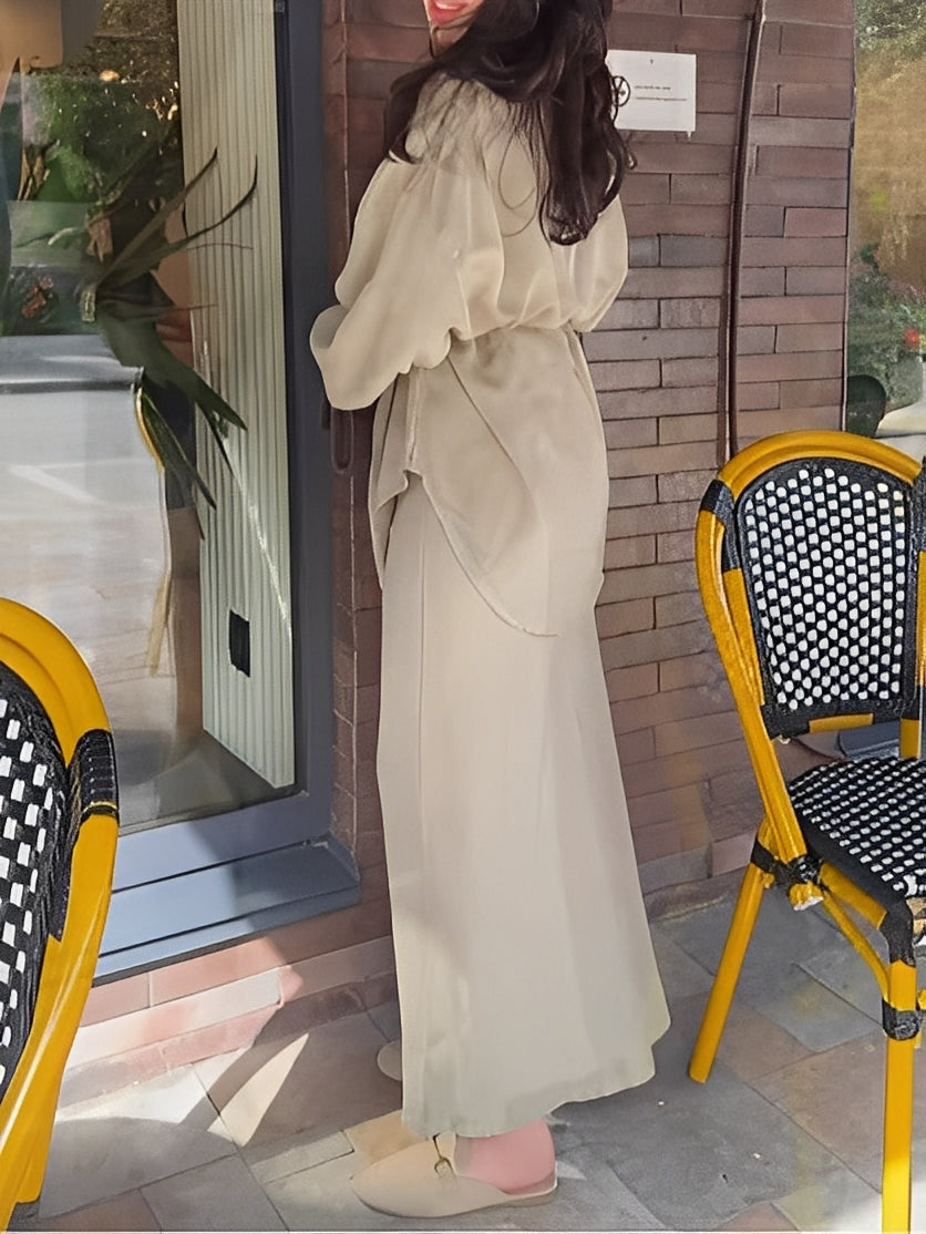 Stylish women's coordinated outfit: button shirt and maxi skirt set. Easy-to-wear two-piece for any event.