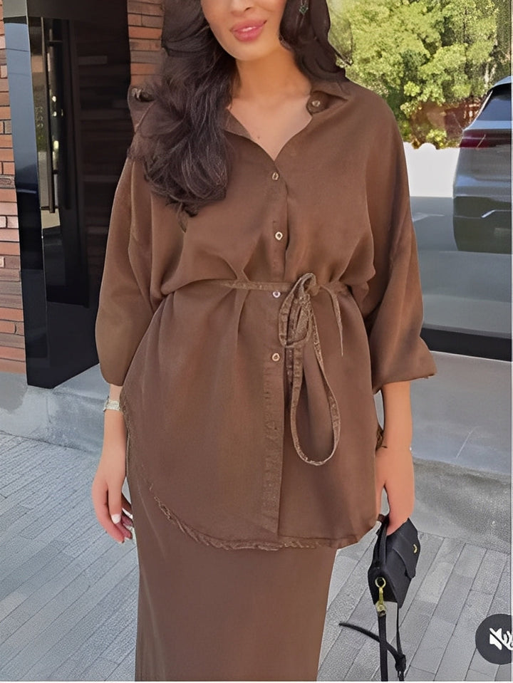 Women's fashion coordinated set: long-sleeve button shirt and elegant maxi skirt. Chic two-piece outfit.
