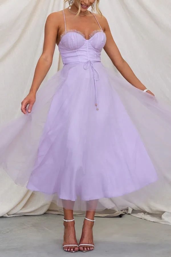 Front view of a women's elegant midi dress, featuring a chic corset bodice and a delicate layered skirt.