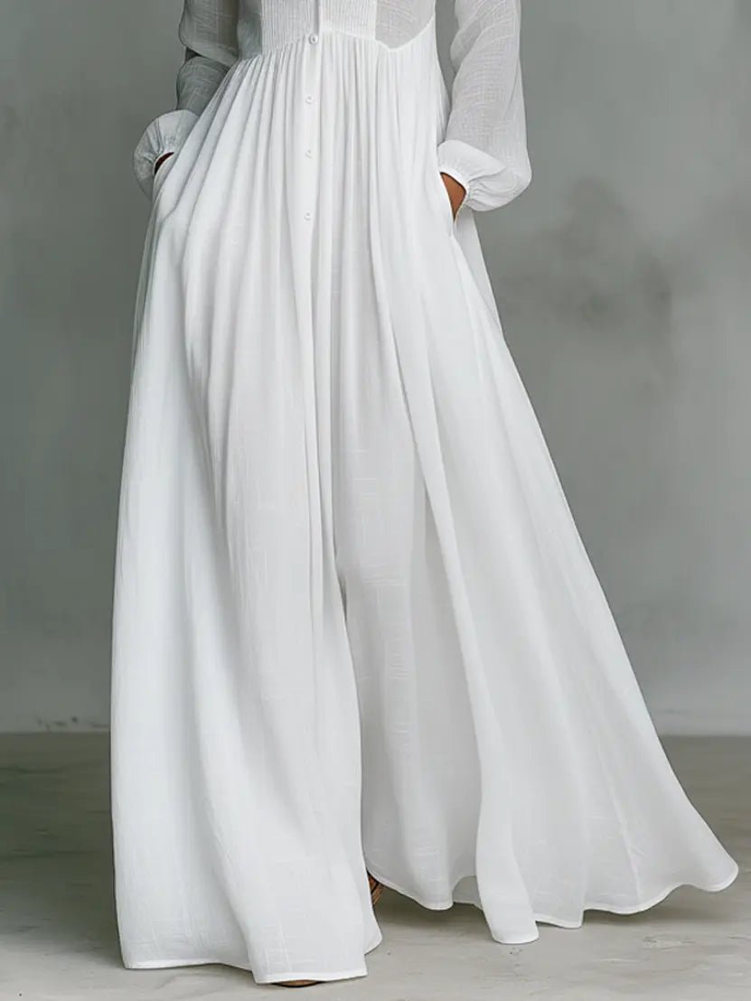 Spring/Summer women's flowy maxi dress. Elegant stand collar, button-front, and subtle patchwork on cotton linen.