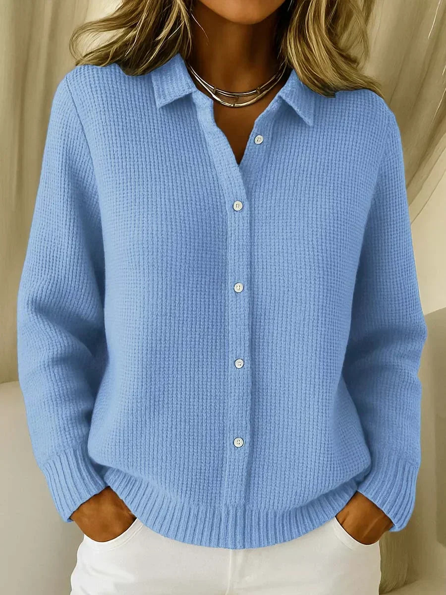 Women's elegant cozy cardigan sweater, a chic button-front longline layering piece for comfortable autumn style.