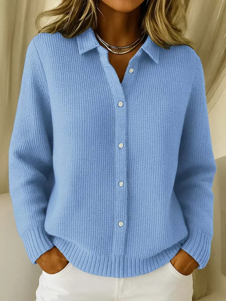Women's elegant cozy cardigan sweater, a chic button-front longline layering piece for comfortable autumn style.