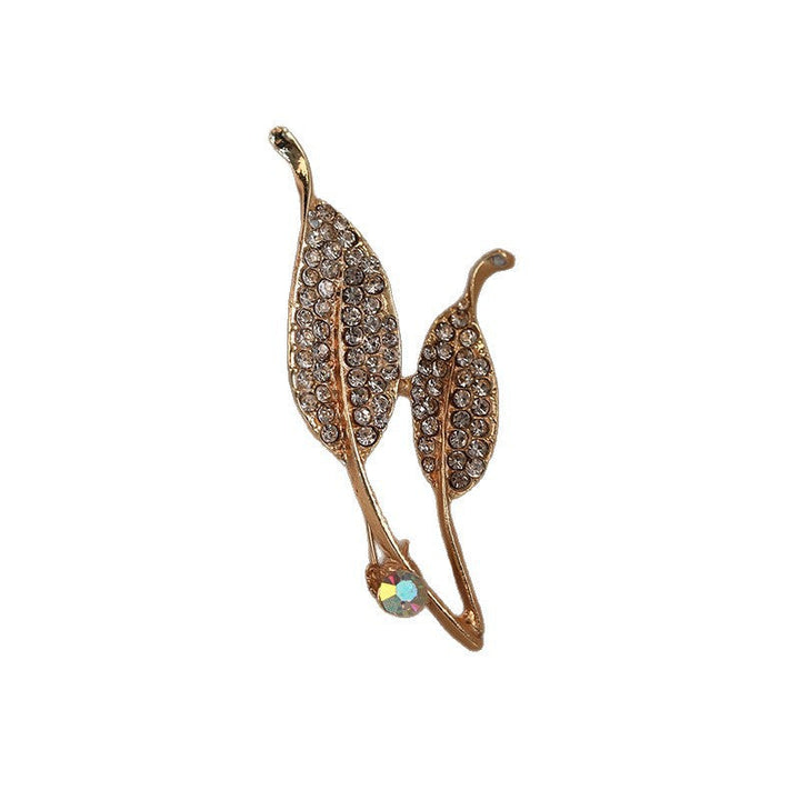 Glamorous women's crystal leaf brooch. Gold-finish elegant lapel pin, perfect for evening wear or daily style.