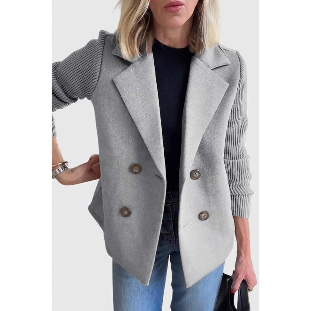 Modern women's double-breasted blazer, a chic and versatile outerwear piece for contemporary professional fashion.