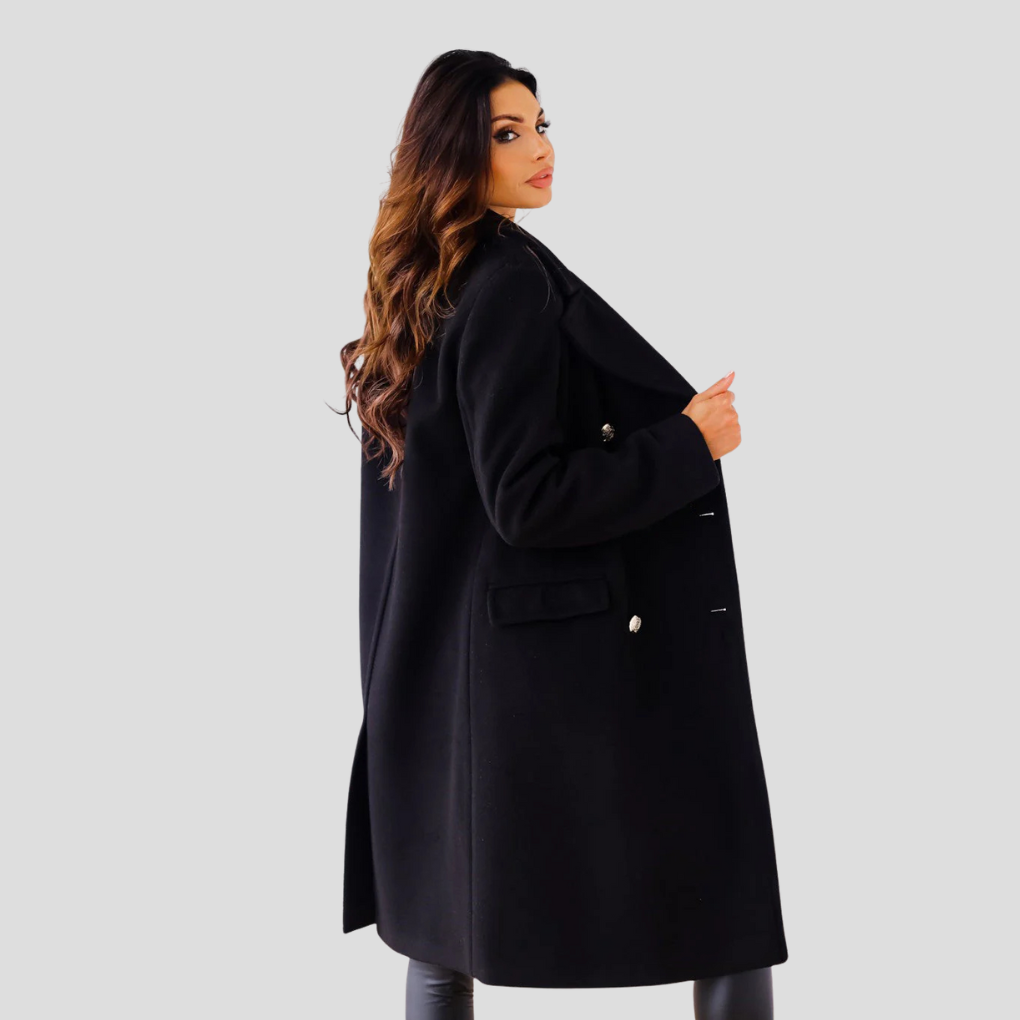 Chic women's double-breasted long coat in a neutral color, ideal for professional or casual wear.