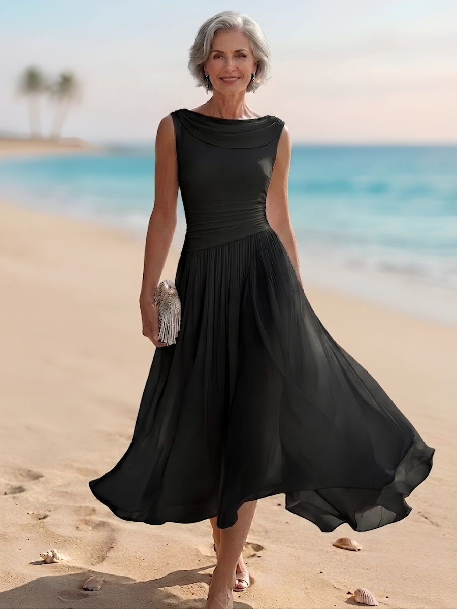Flowy women's sleeveless midi dress, featuring a draped neck and pleated A-line skirt for graceful movement.