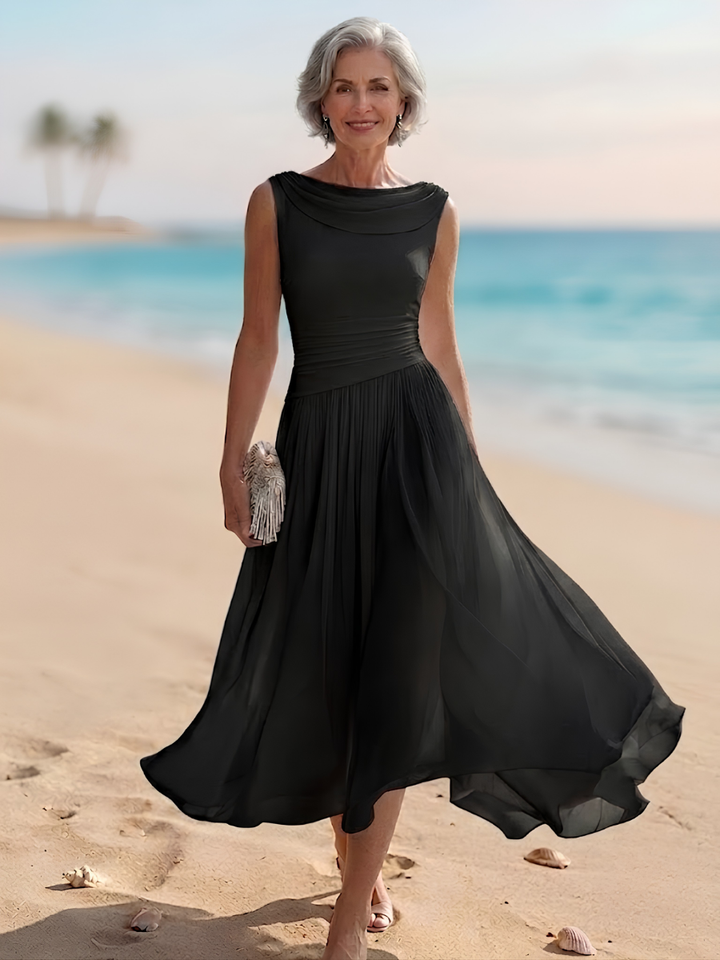 Flowy women's sleeveless midi dress, featuring a draped neck and pleated A-line skirt for graceful movement.