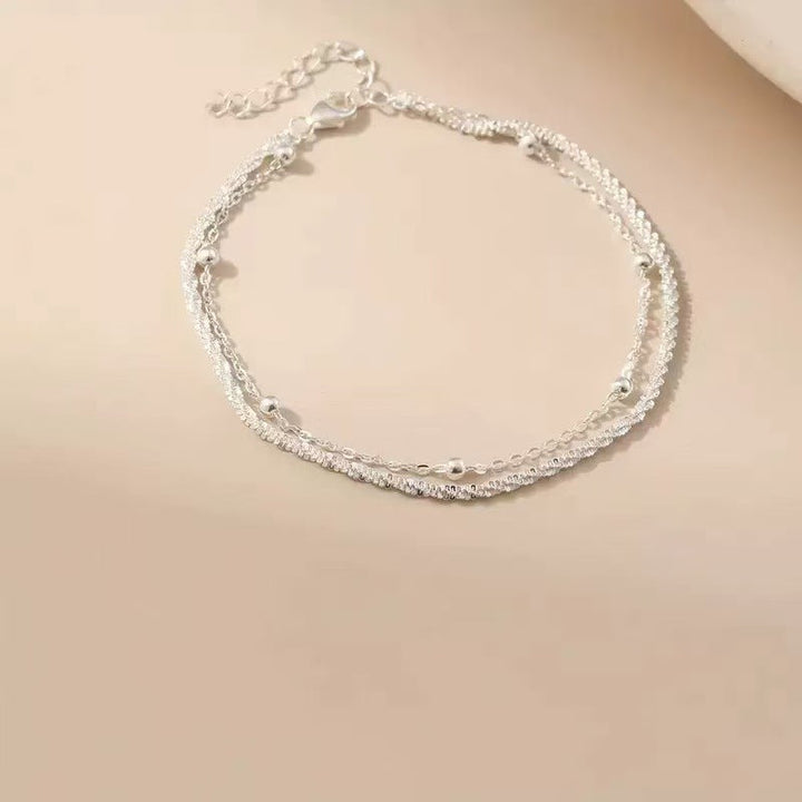 Versatile women's dual-layered silver bracelet, an elegant fashion accessory & perfect gift for her.