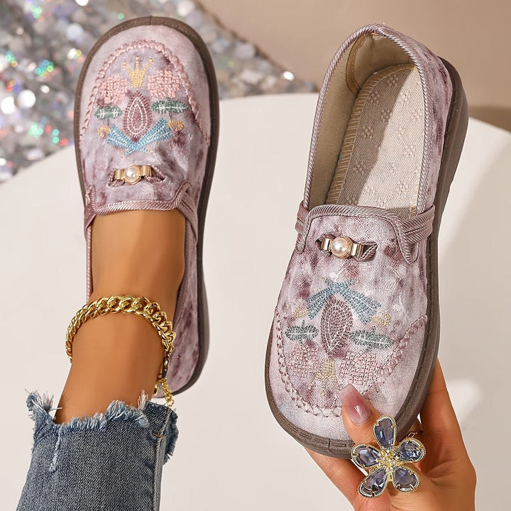 Stylish flat women's loafers with beautiful floral embroidery and elegant pearl accents, comfortable and easy slip-on.