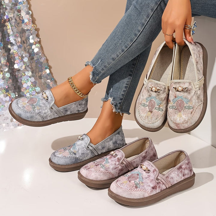 Fashionable beaded women's loafers, featuring elegant floral embroidery and pearl detail, ideal for ladies' casual wear.