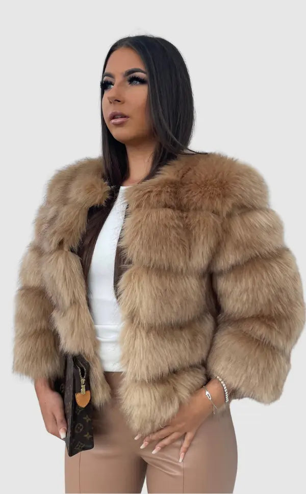 Women's elegant faux fur coat for luxurious winter warmth and style.