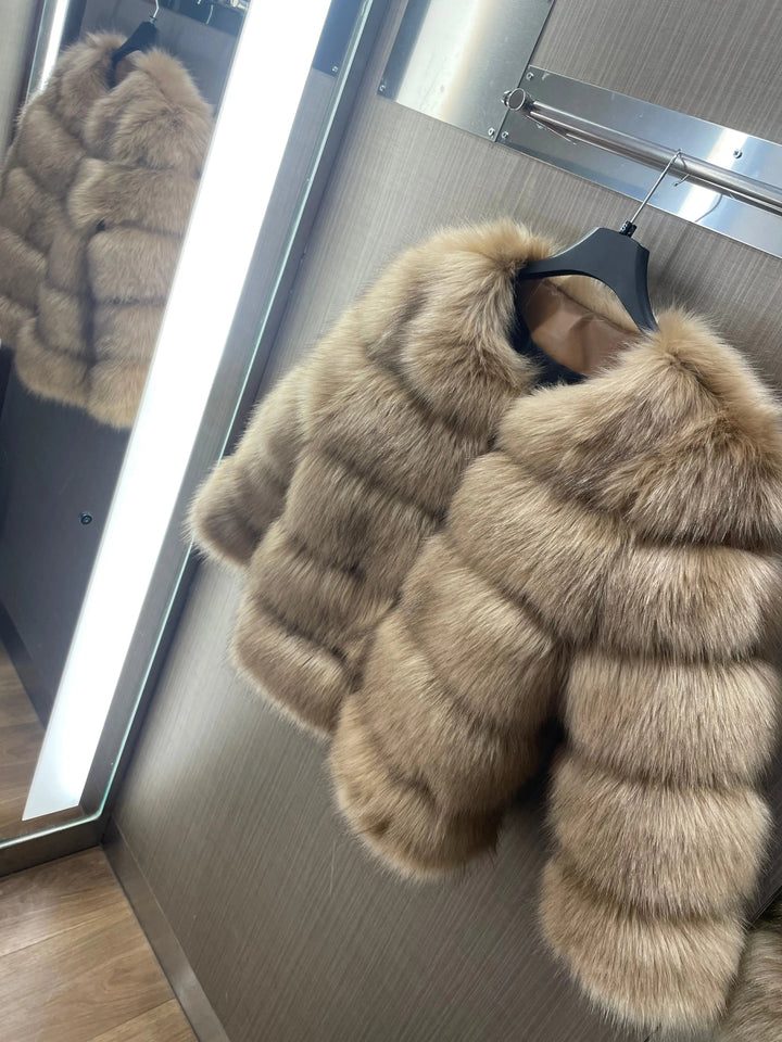 Stylish faux fur coat for women, offering glamorous winter warmth.
