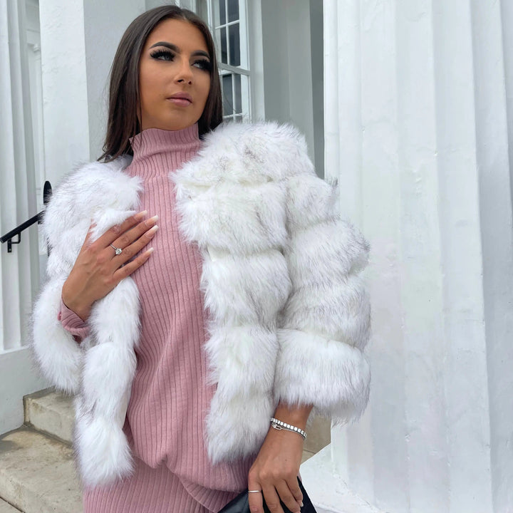Women's luxurious winter coat with elegant faux fur detailing.