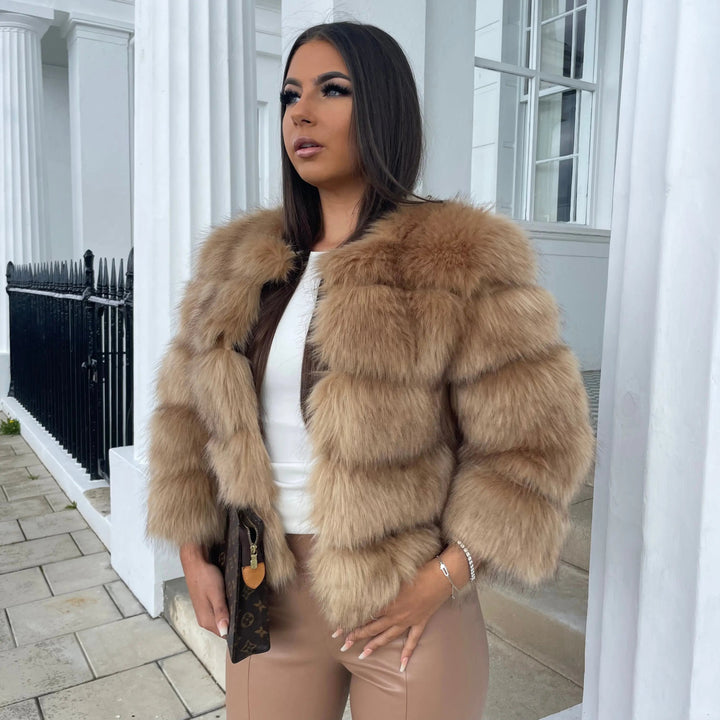 Glamorous women's winter coat, featuring soft faux fur for warmth.