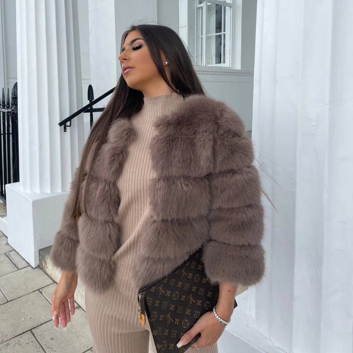 Elegant women's winter faux fur jacket for ultimate warmth and fashion.
