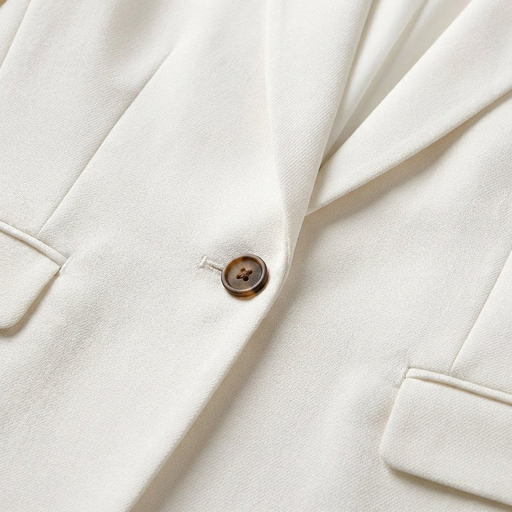 Versatile women's single-breasted white blazer, perfect for professional office, business casual & formal events.