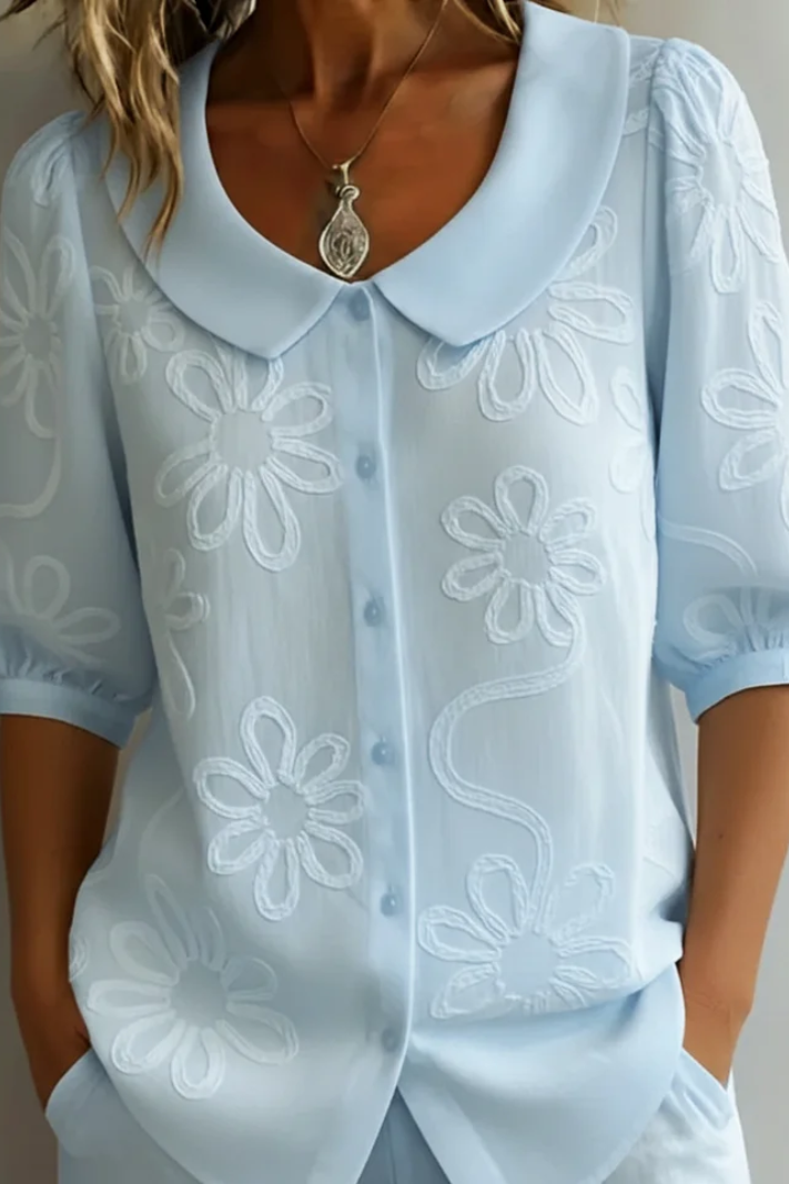 Relaxed fit women's floral blouse, elegant and feminine, perfect for casual spring/summer fashion.