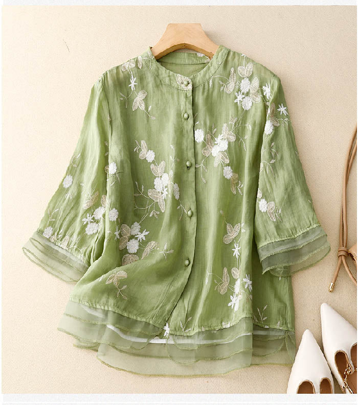 Women's elegant floral button-down blouse with 3/4 sleeves. Stylish and versatile for spring & summer.