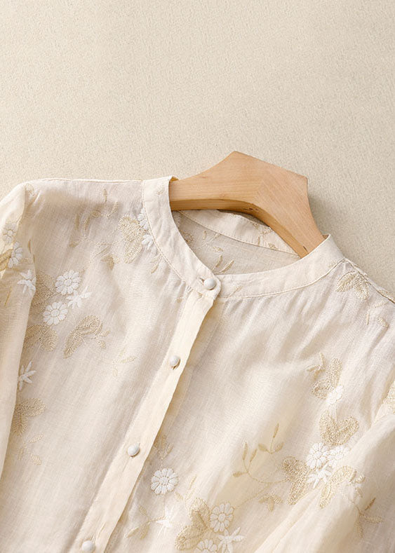 Model wearing a casual women's floral button-down blouse with 3/4 sleeves, perfect for everyday style.