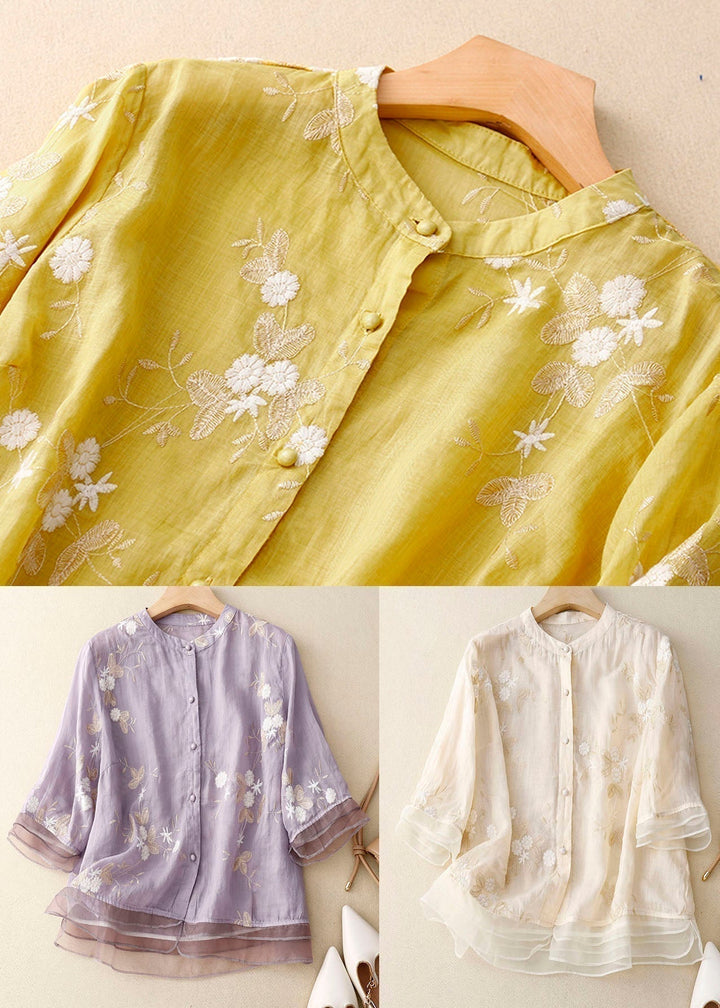 Versatile women's floral button-down blouse with 3/4 sleeves, easily dressed up or down for any occasion.