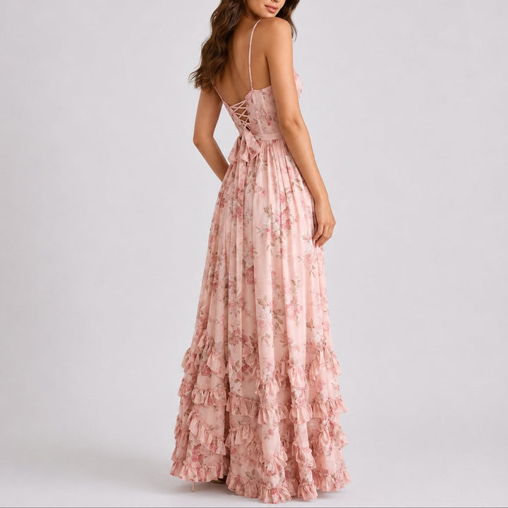 Elegant women's floral maxi dress, a stylish wedding guest gown with corset, spaghetti straps, & ruffle hem.