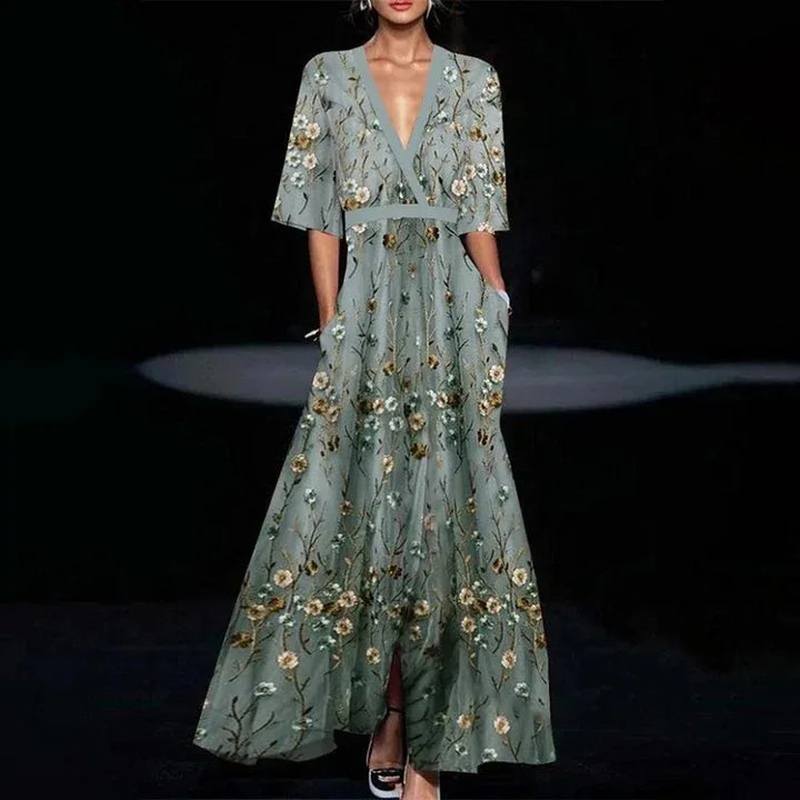 Women's elegant floral evening dress with flattering V-neck and 3/4 sleeves, perfect for special occasions.