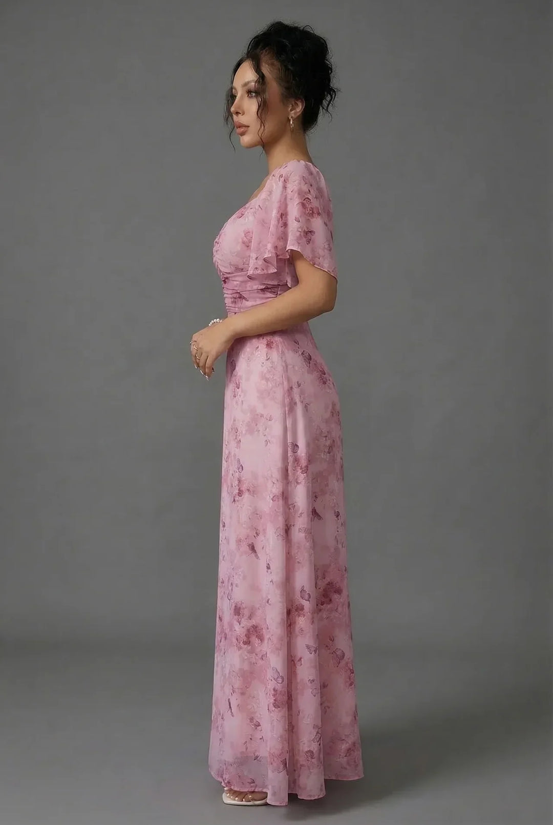 Romantic floral maxi dress for women featuring flutter sleeves & sweetheart neckline, ideal for wedding guests.