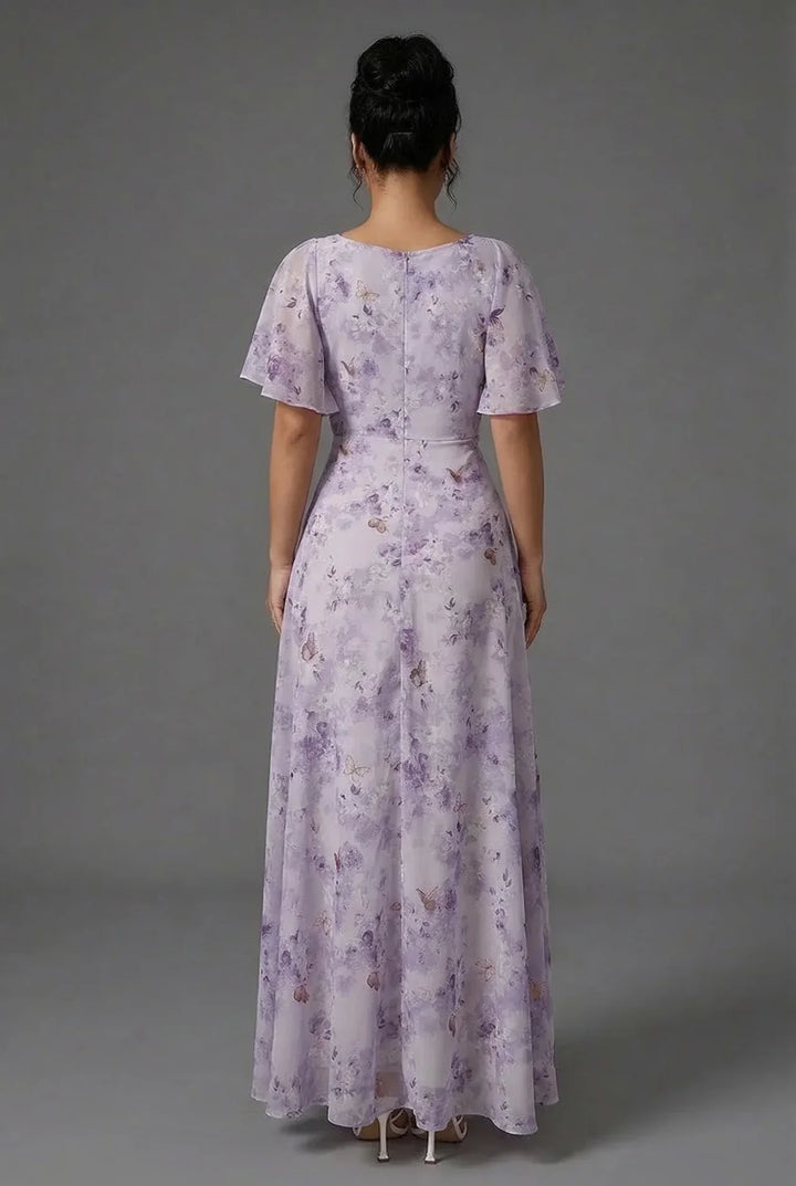 Vibrant women's floral maxi dress, featuring romantic flutter sleeves, ideal for spring & summer fashion.