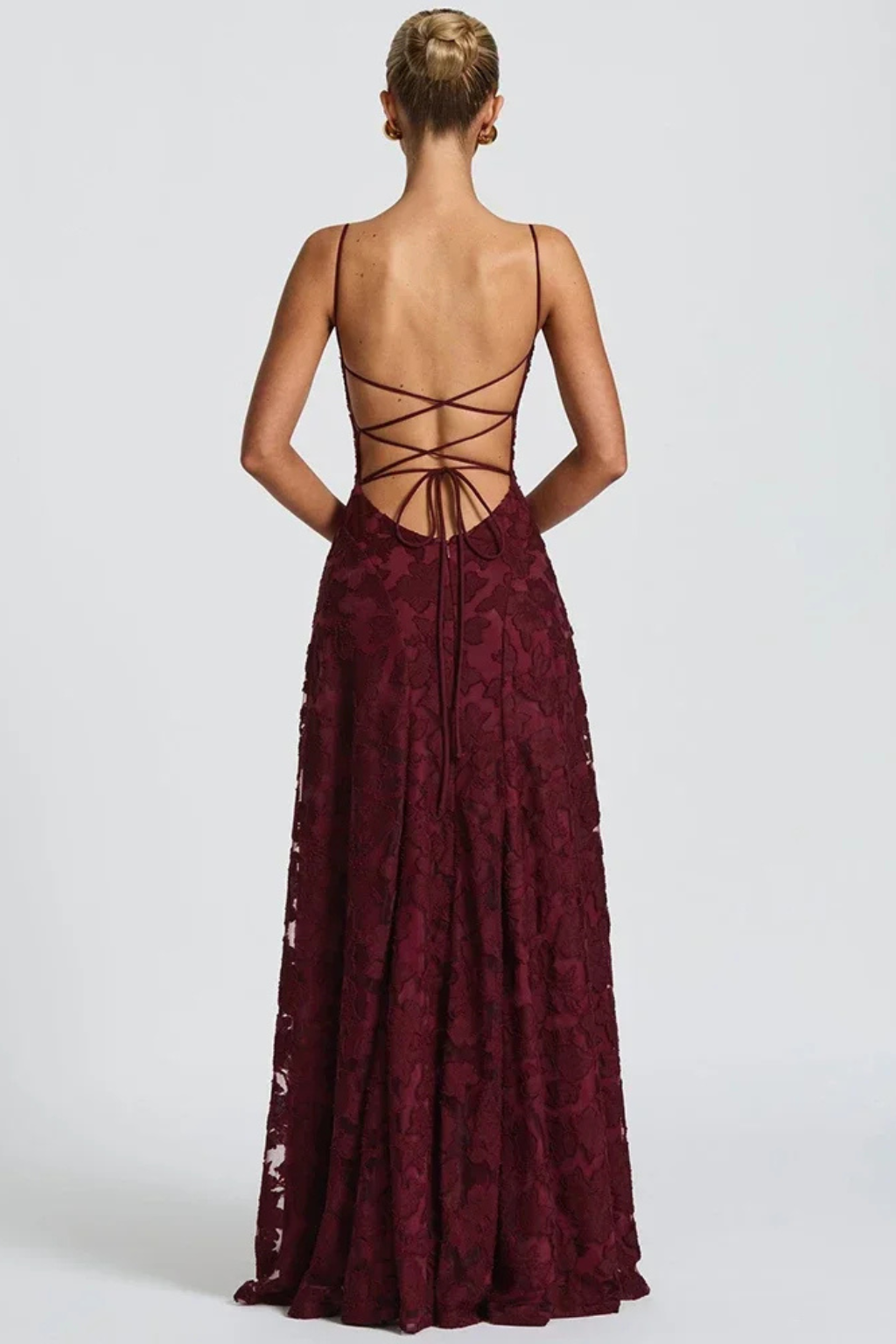 Women's floral jacquard maxi dress, back view showing elegant lace-up detail & floor-length formal design.