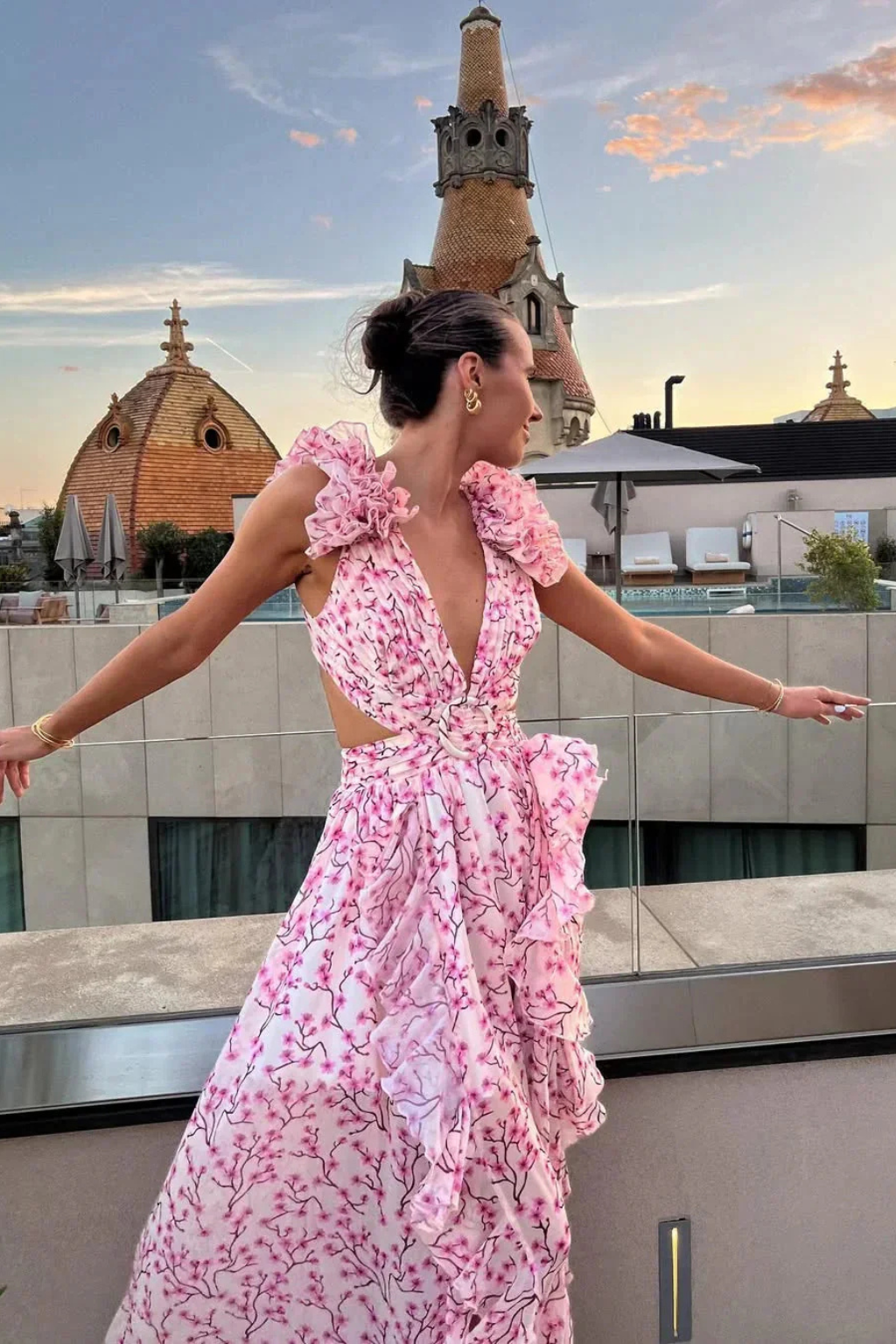 Stylish women's floral maxi dress with a flattering ruffle V-neck, suitable for elegant wedding guests.