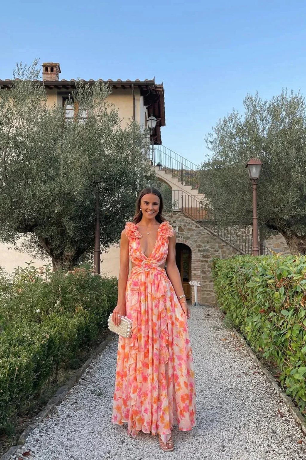 Vibrant floral print women's maxi dress, with a charming ruffle V-neck, great for summer fashion.