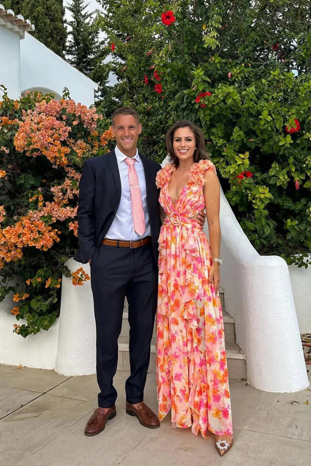 Women's formal floral maxi dress with ruffle V-neck, ideal for sophisticated wedding guest attire.