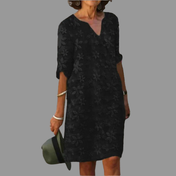 Versatile women's floral midi dress for everyday elegance. Features a V-neck, half sleeves, and comfortable fit.