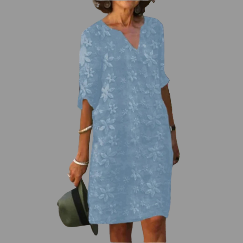 Comfortable women's floral midi dress, ideal for casual wear or special occasions. V-neck, half sleeves, stylish fit.