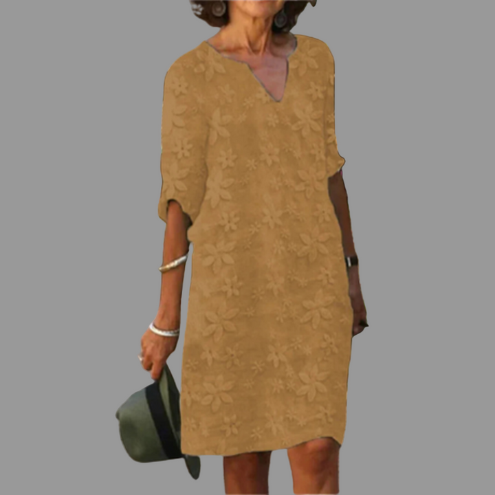 Elegant women's floral midi dress, a versatile summer fashion essential. V-neck, half sleeve, available in plus sizes.