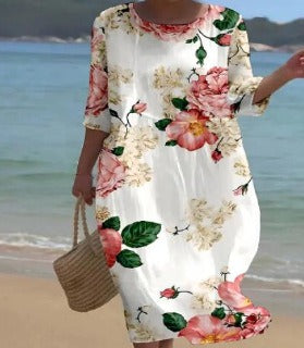 Elegant women's floral midi dress, a versatile piece for spring/summer, offering comfortable and chic style.