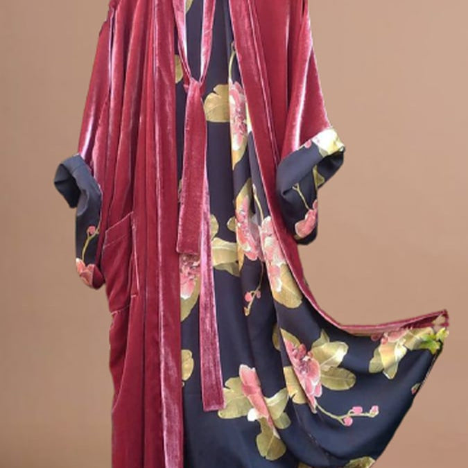 Close-up of elegant women's floral off-shoulder pajama dress. Intricate flower pattern on comfortable sleepwear.