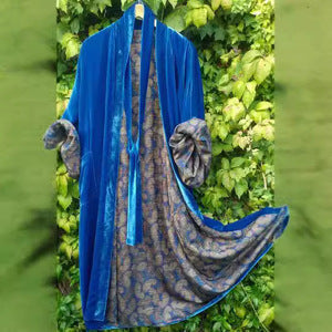 Belted women's floral pajama dress. Elegant off-shoulder design with adjustable waist for comfort and style in sleepwear.