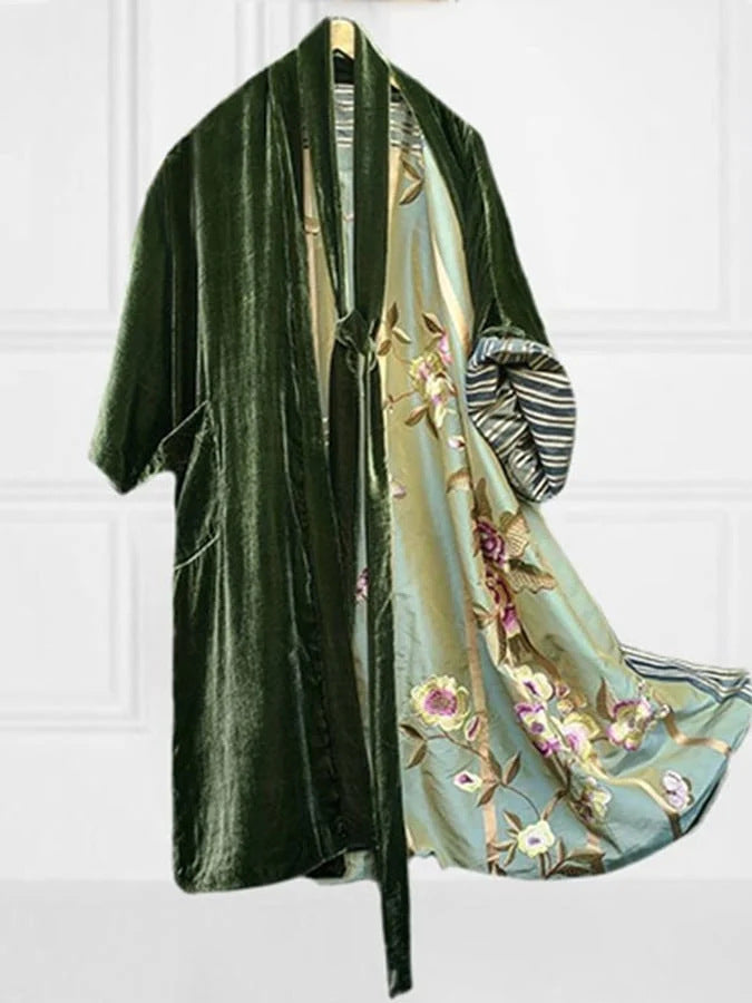 Soft fabric texture of elegant women's floral off-shoulder pajama dress. Comfortable belted sleepwear for luxurious lounging.
