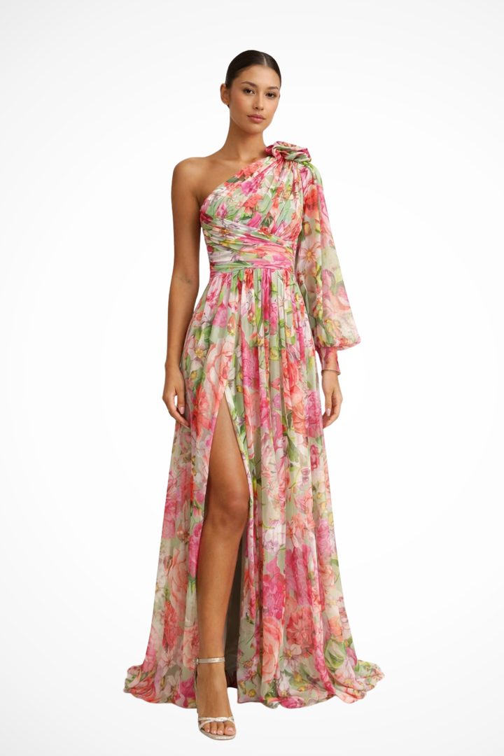 Purple floral one-shoulder wedding guest maxi dress. Elegant women's evening wear with a sophisticated draped neckline.