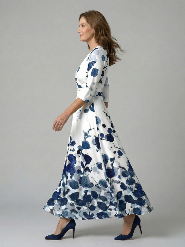 Fashionable women's floral wrap midi dress with a V-neck, three-quarter sleeves, and defined waist.