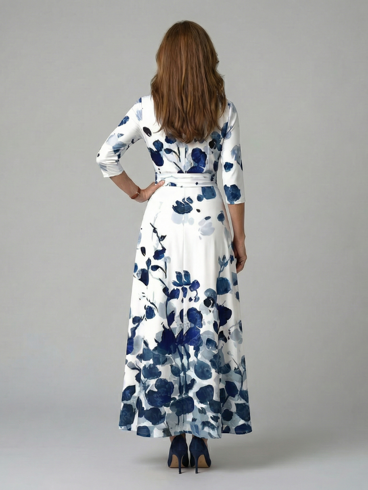 Elegant women's midi dress, floral pattern, cross V-neck, 3/4 sleeves, defined waist for a chic silhouette.