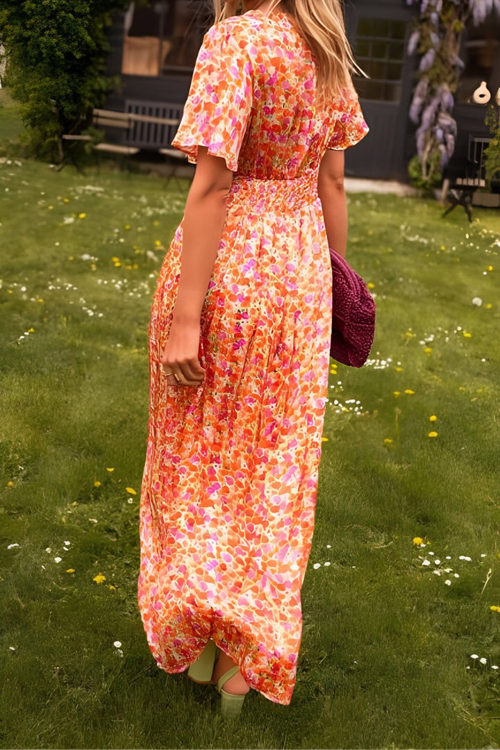 Vibrant floral print V-neck short-sleeve maxi dress, exuding effortless elegance for women's summer events.