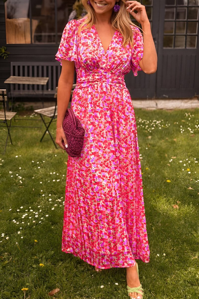 Feminine floral short-sleeve maxi dress with a stylish V-neck for women, perfect for a flowy summer look.