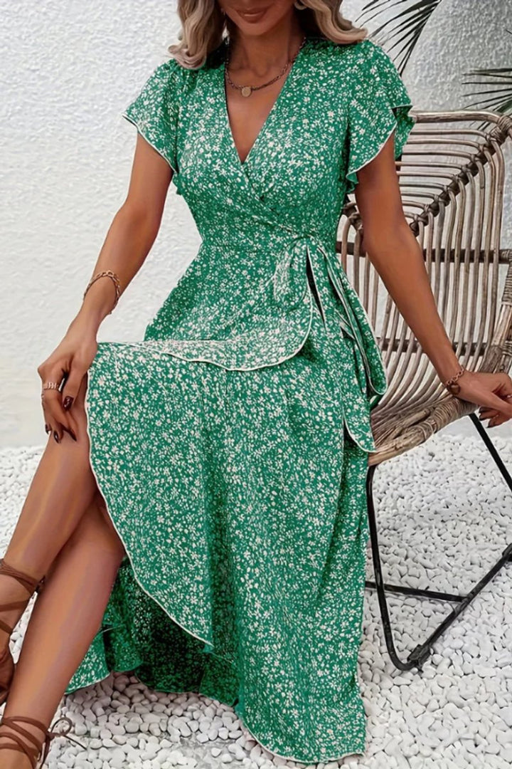 Elegant wedding guest floral wrap midi dress with delicate flutter sleeves and V-neck.