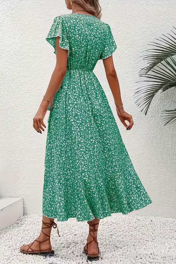 Stylish floral wrap midi dress for women, showcasing a beautiful print and flutter sleeves.