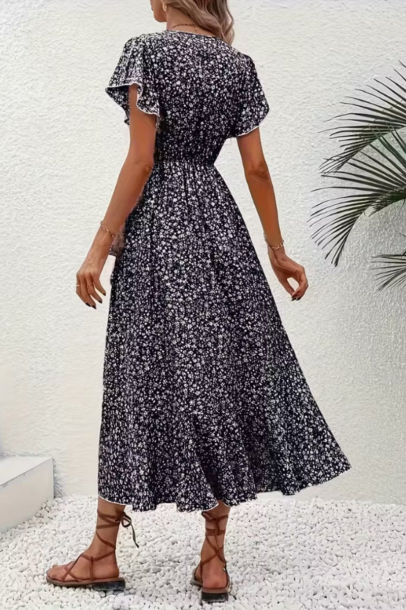 Delicate flutter-sleeve floral midi wrap dress, perfect for any elegant summer gathering.